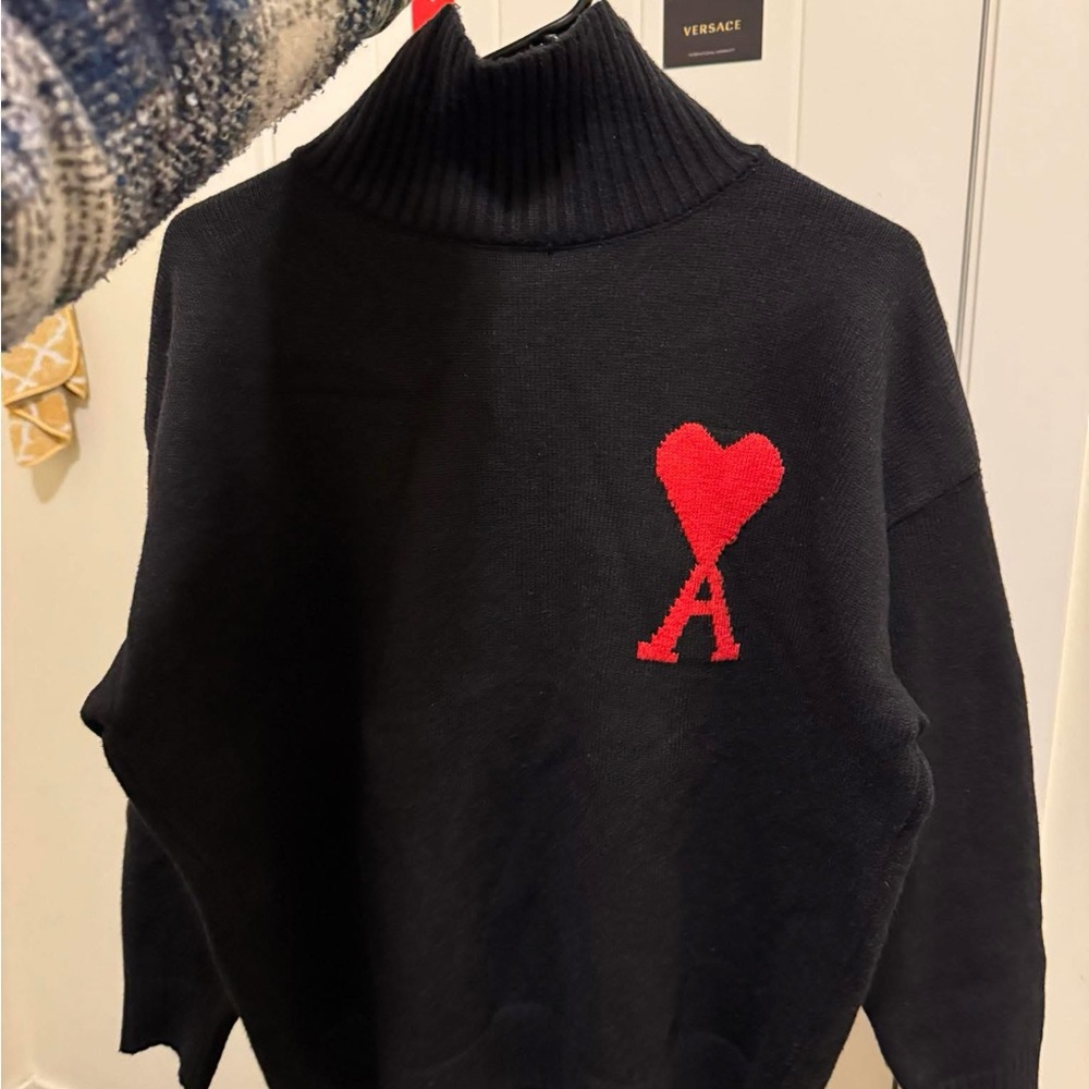 Black Turtleneck Sweater with Red Heart Detail